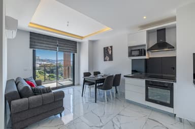 Продается стильная квартира в Махмутларе у моря всего за 52,000 EUR!